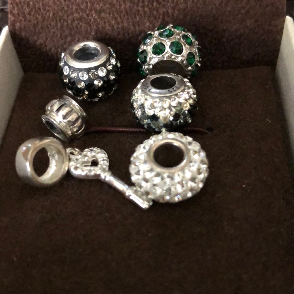 5 sterling silver bracelet charms. Fits Pandora bracelet or something similar.